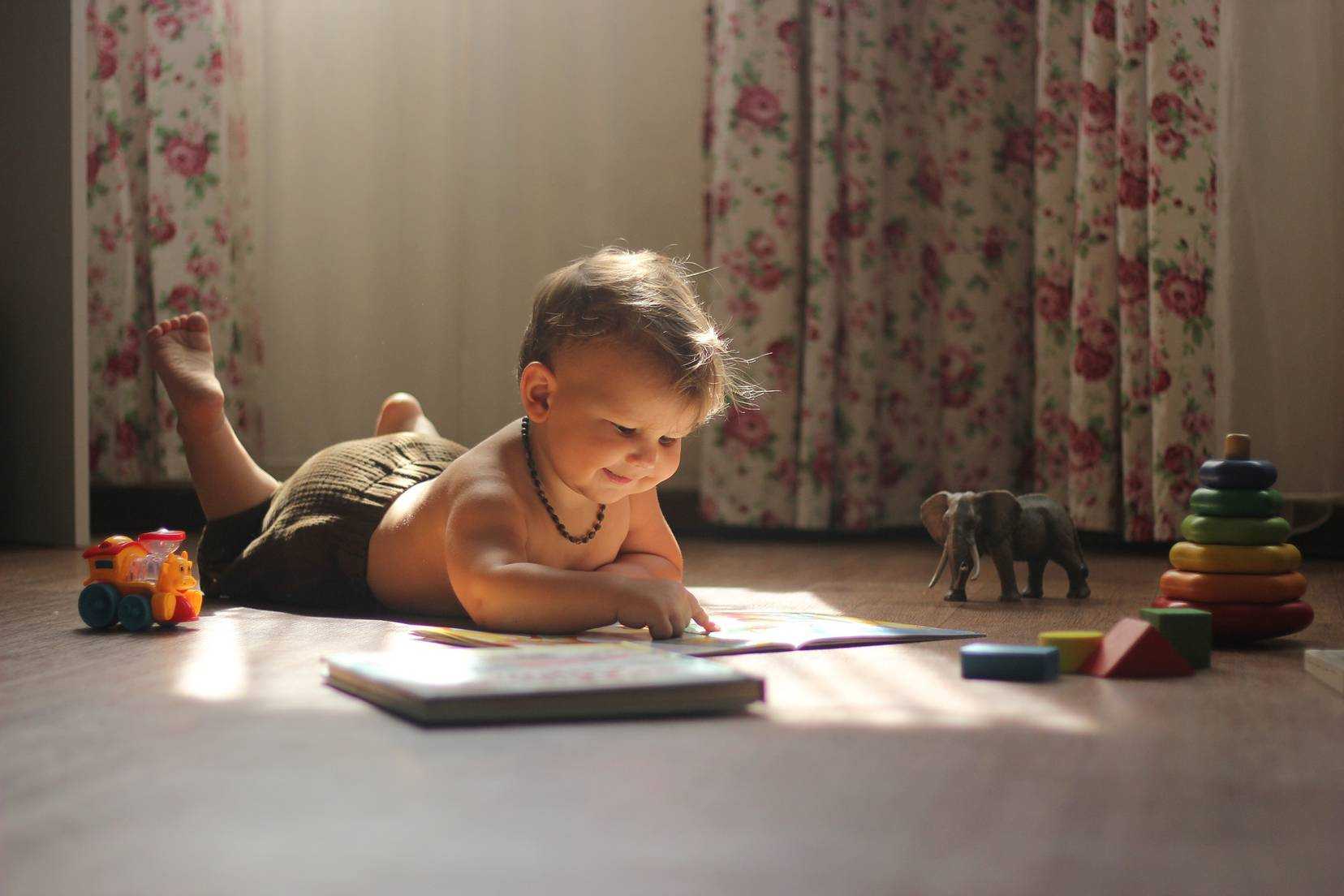 Cute little boy is happy to exploring new books.